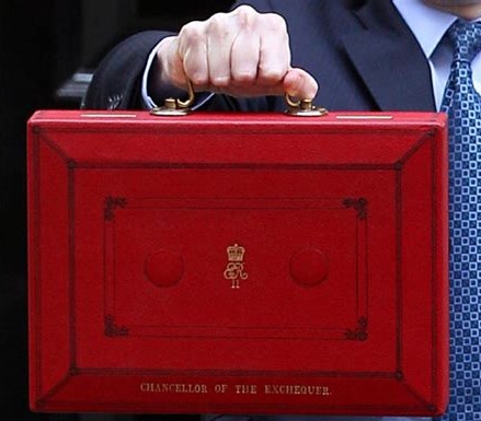 Mutual militarisation. Chancellor holding his red case. Increased defence spending promises in the 2023 Spring Budget.